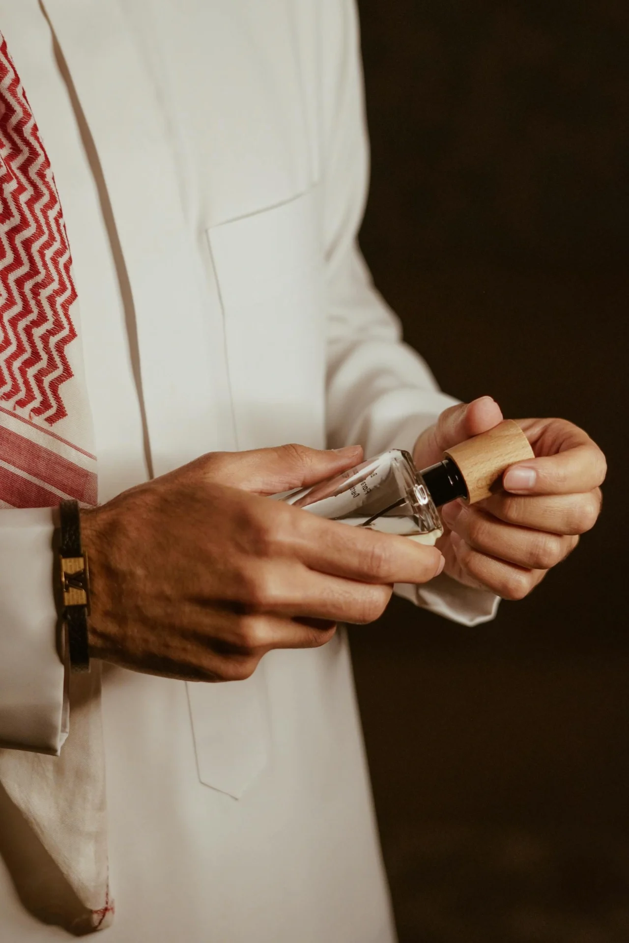RangeKhushboo - man hands holding perfume 21614757 scaled 1